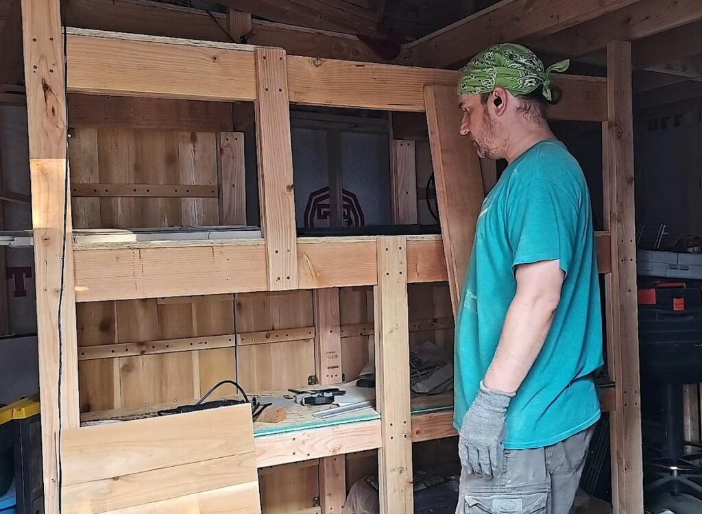 hand constructed, rolling shelf wall