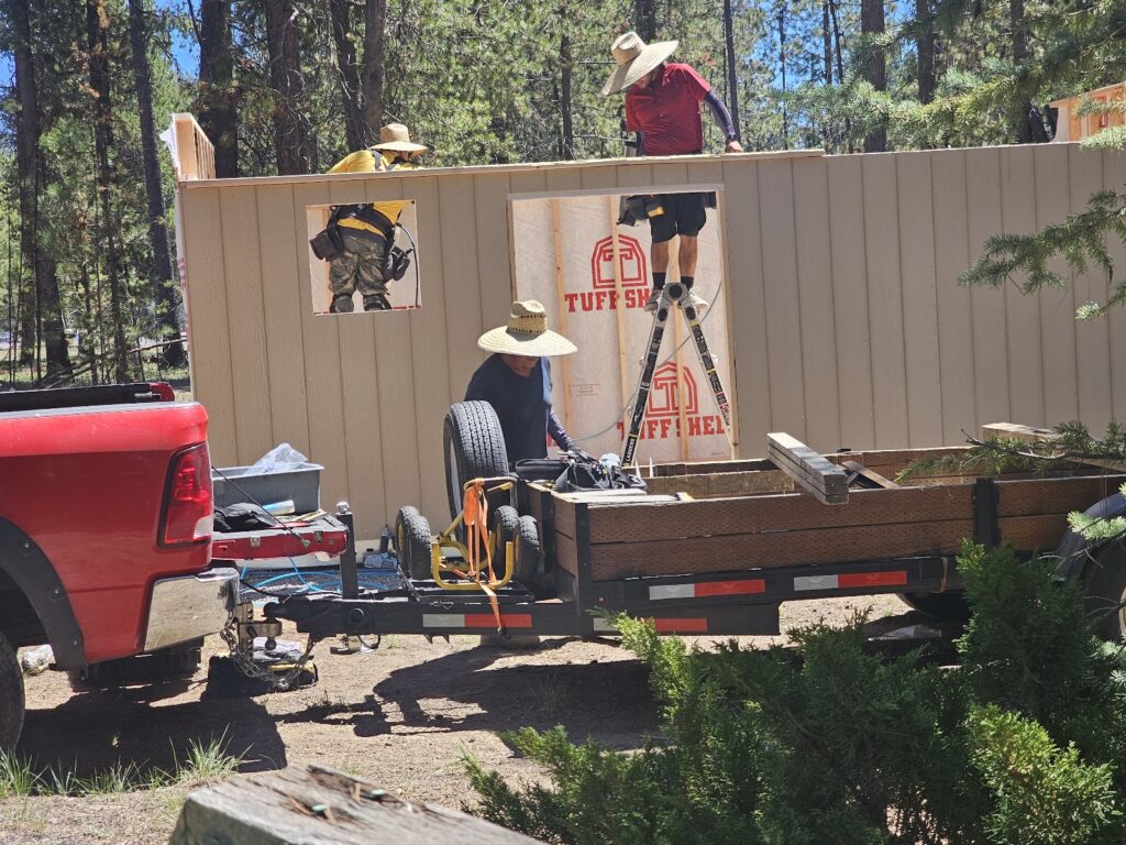 efficient 3-man team building the shop