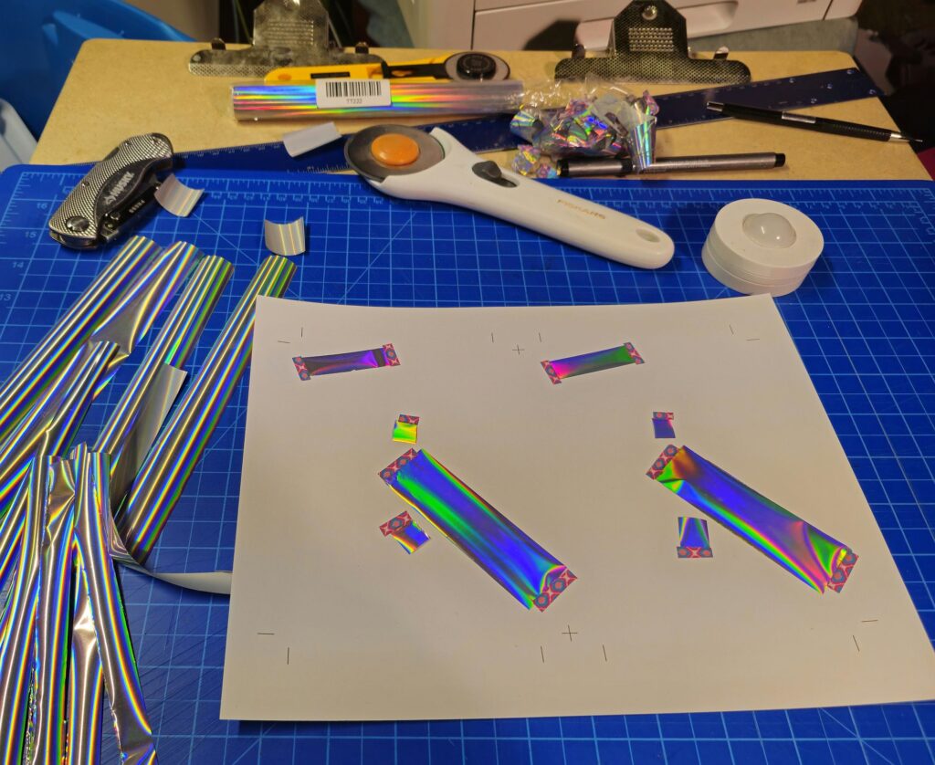 Postcards with hand-laminated toner reactive film strips